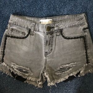 Grey high waisted jean shorts with black pockets
